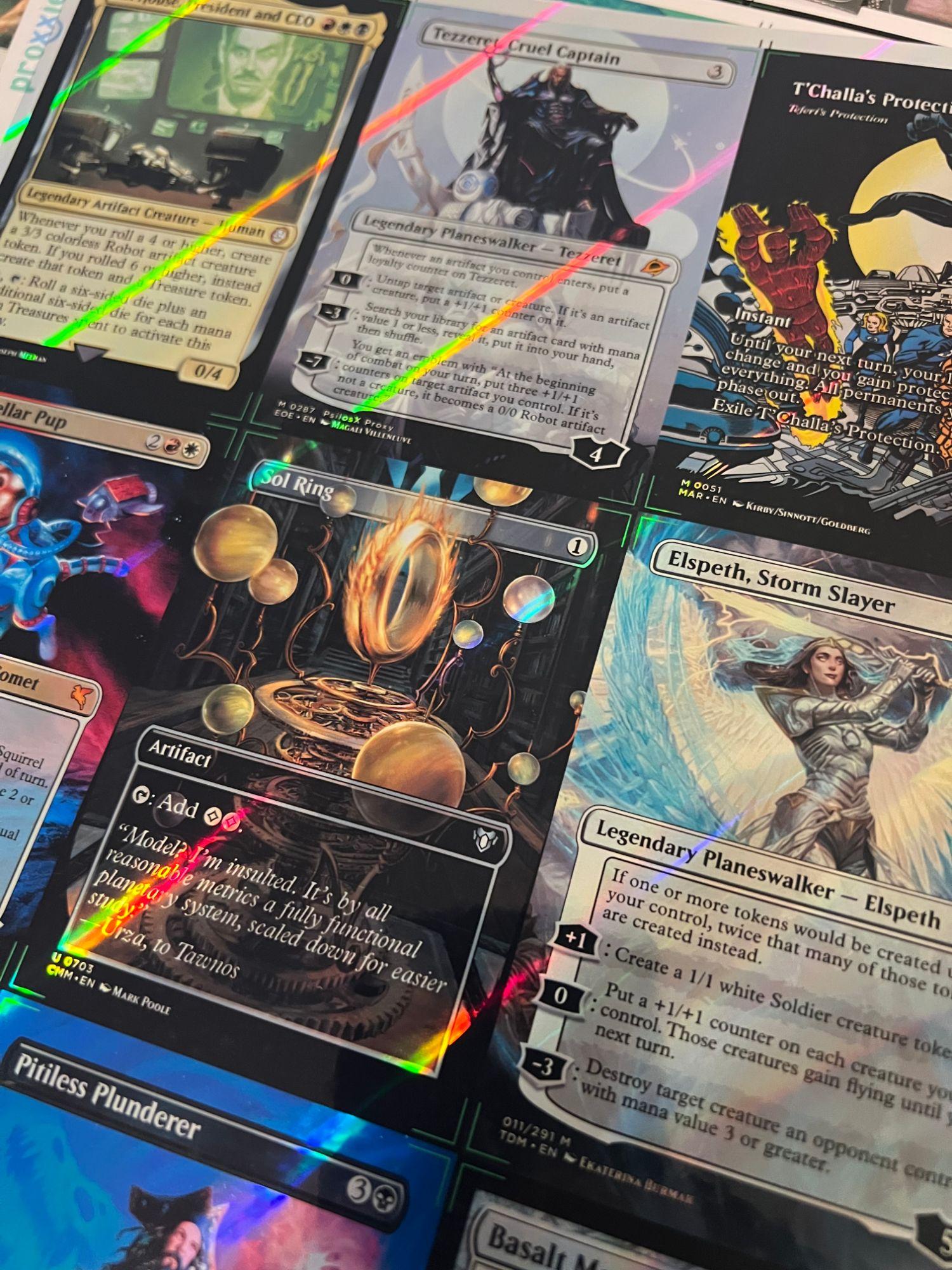Nine up on the sheet — Sol Ring, Tezzeret, Elspeth — before the cutter.