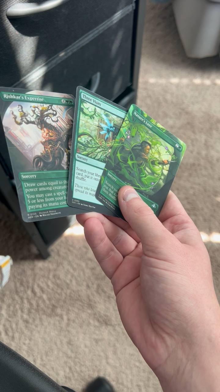A fan of green foil proxies catching the light