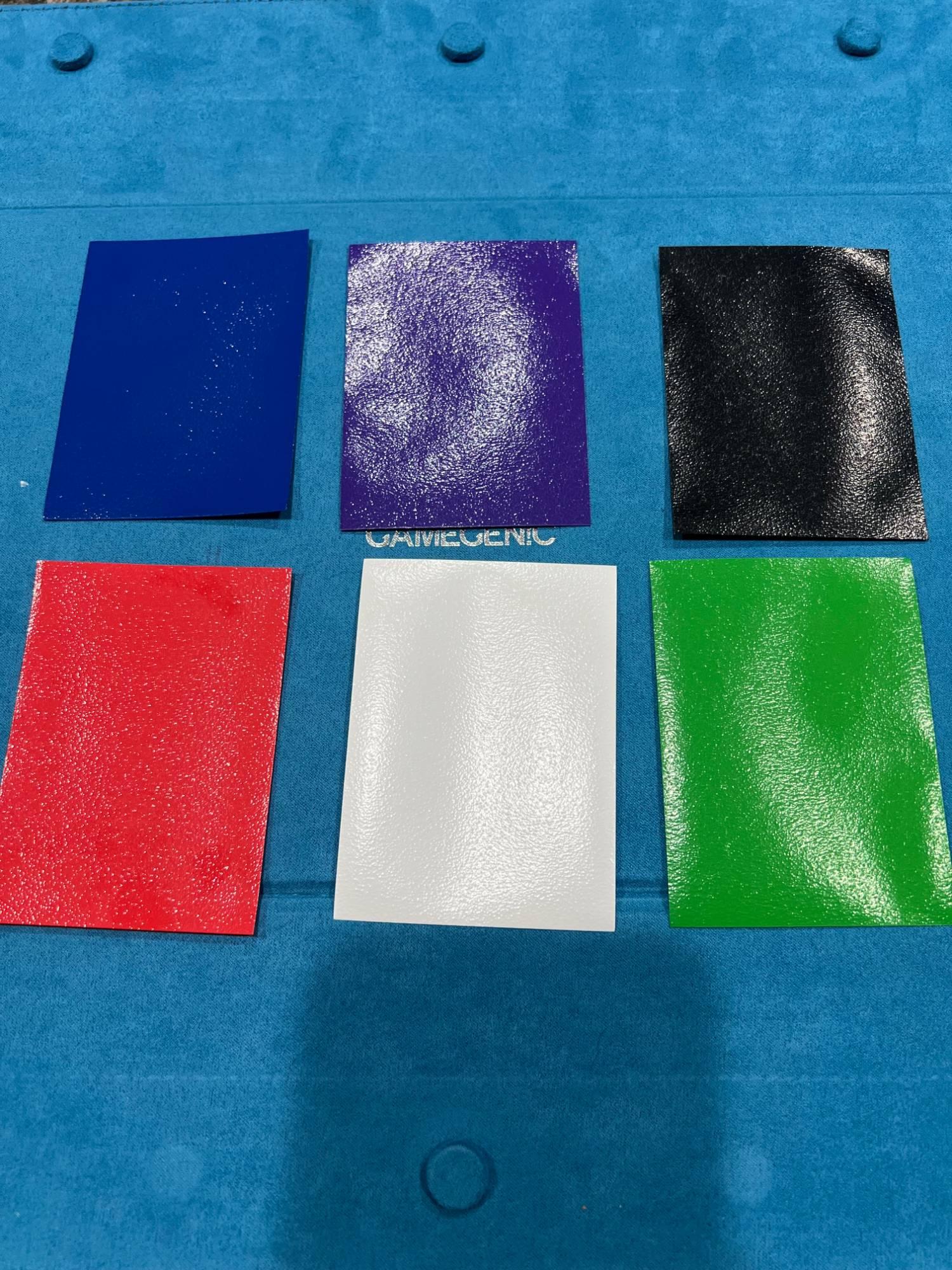 The six sleeve colors laid out: blue, purple, black, red, white, green